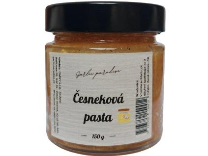 Skleněná nádobka s česnekovou pastou v bílém etiketu.