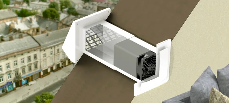 Lokální rekuperátor s průhledným krytem ukazuje vnitřní ventilátor a filtr.