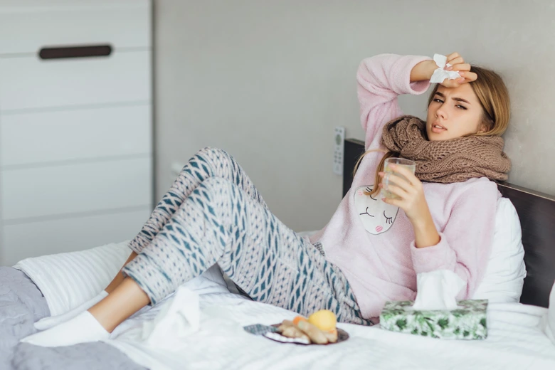 Woman sick in bed