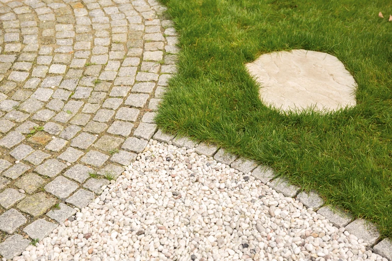 Garden path with stones and grass