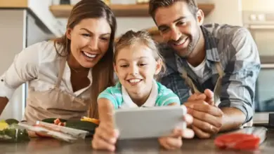 Family using smartphone in kitchen