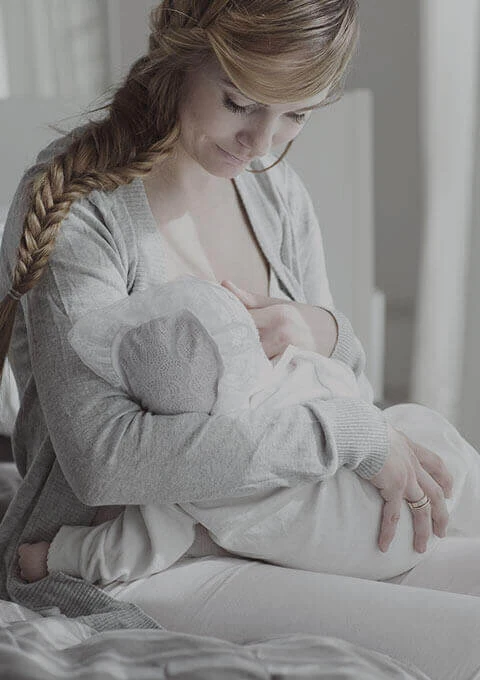 Mother breastfeeding baby