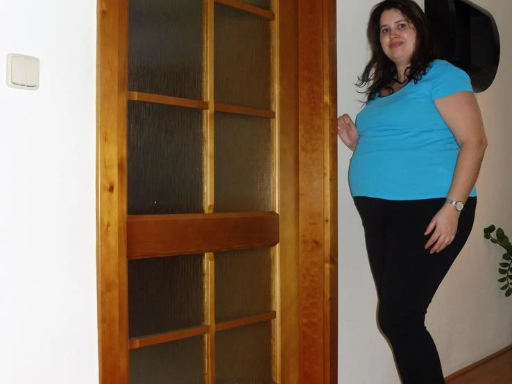 Pregnant woman standing indoors