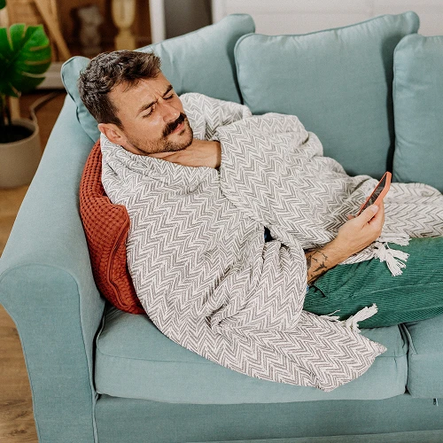 Man sick on couch